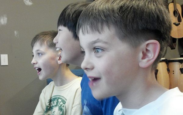 Kids watching flight simulator